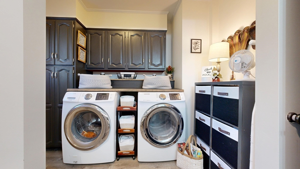 101 King Street, Unit 101 Reading, MA 01867 - Photo 22 of 33 a view of washer and dryer in a utility room