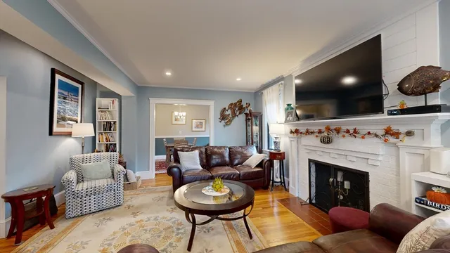 a view of a livingroom with furniture and a fireplace