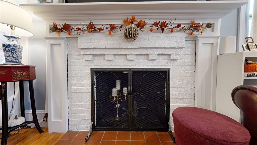 101 King Street, Unit 101 Reading, MA 01867 - Photo 8 of 33 a view of a livingroom with furniture and a fireplace