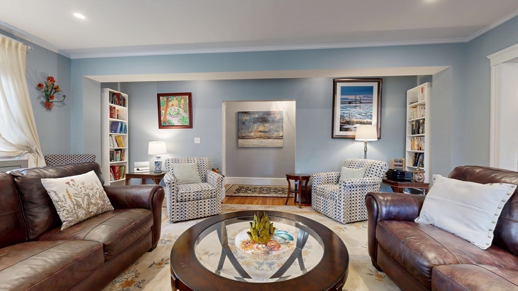 101 King Street, Unit 101 Reading, MA 01867 - Photo 10 of 33 a living room with furniture and a wooden floor