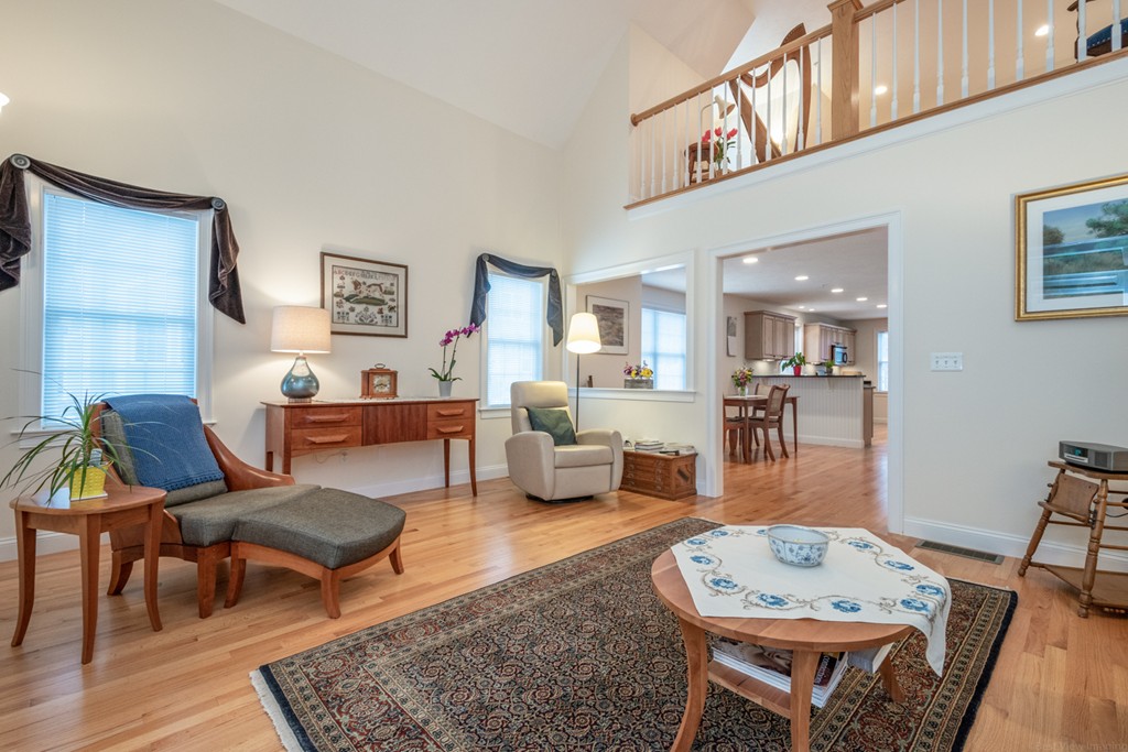 1094 Hill Road, Unit 1094 Boxborough, MA 01719 - Photo 12 of 38 a living room with furniture and a table