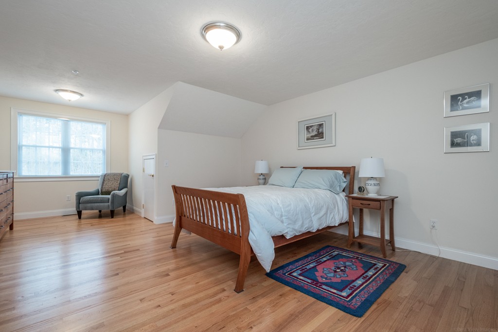 1094 Hill Road, Unit 1094 Boxborough, MA 01719 - Photo 30 of 38 a bedroom with furniture and a window