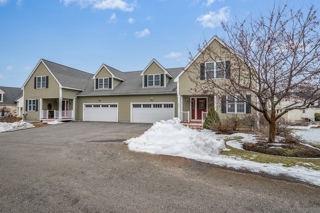 1094 Hill Road, Unit 1094 Boxborough, MA 01719 - Photo 3 of 38 a front view of a house with a yard