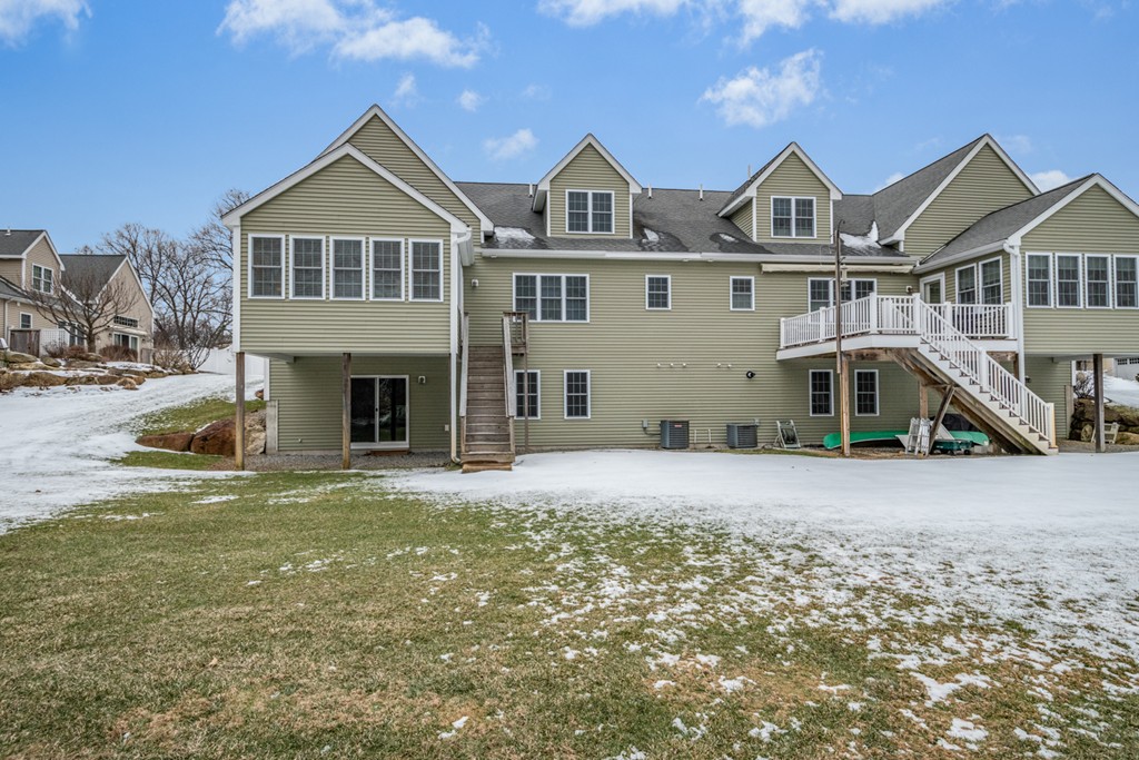 1094 Hill Road, Unit 1094 Boxborough, MA 01719 - Photo 34 of 38 a front view of a house with a yard