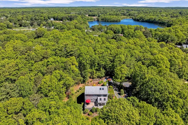 a kitchen with granite countertop a stove sink and cabinets