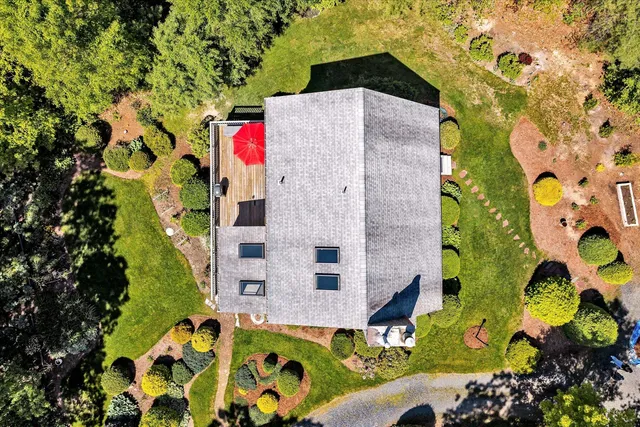 a view of a livingroom with workspace and a window