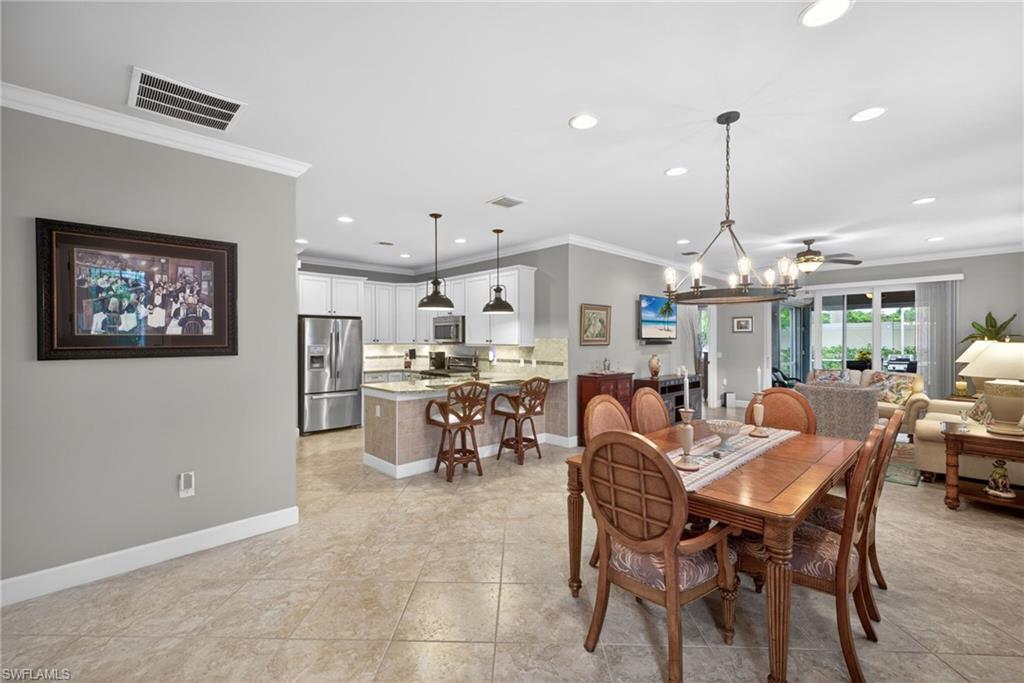 20105 Torch Key Way Estero, FL 33928 - Photo 3 of 29 a view of a dining area with furniture