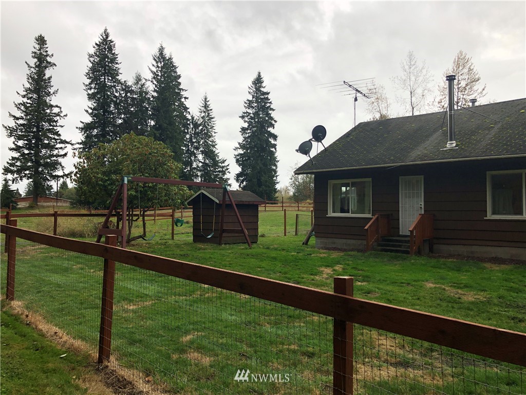 17706 Butler Road Snohomish, WA 98290 - Photo 1 of 22 a front view of a house with a yard