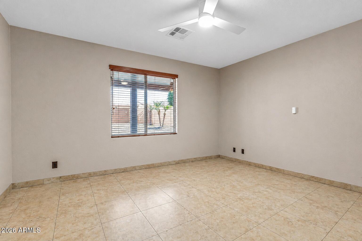 3048 East Erie Street Gilbert, AZ 85295 - Photo 18 of 41 a view of an empty room with a window