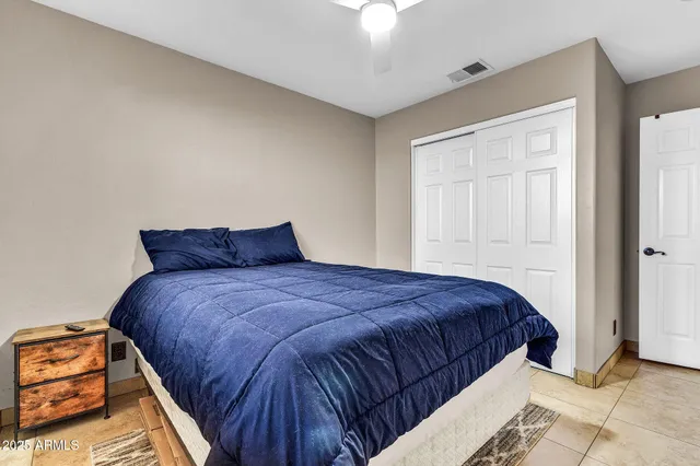 a bedroom with bed and window