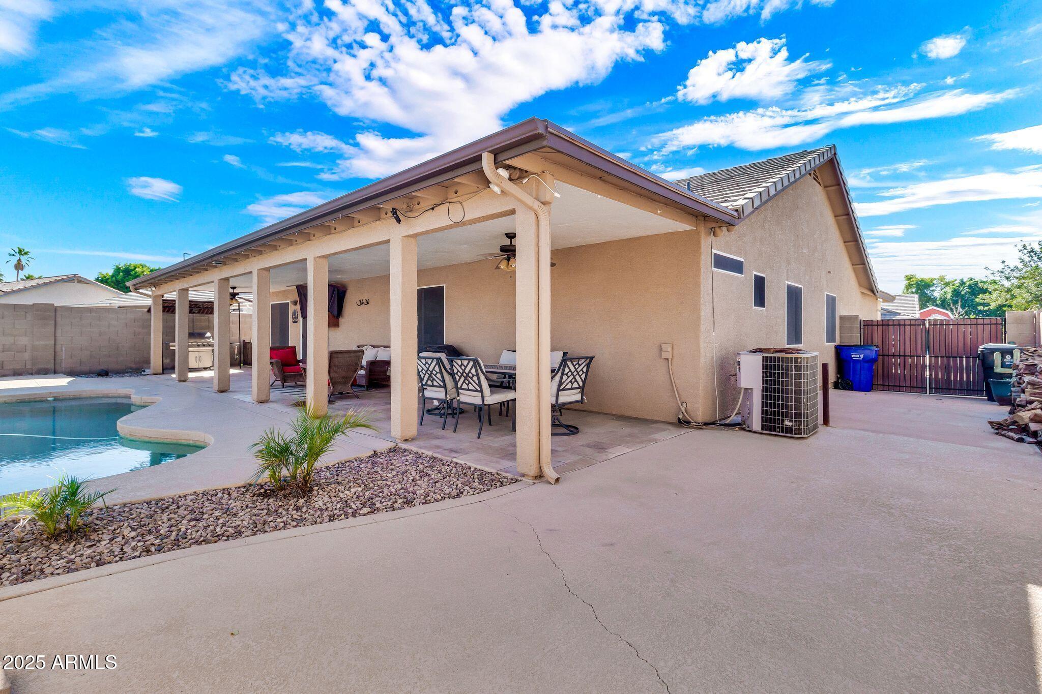 3048 East Erie Street Gilbert, AZ 85295 - Photo 30 of 41 a view of a house with a patio