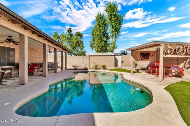 a view of a porch with a table and chairs