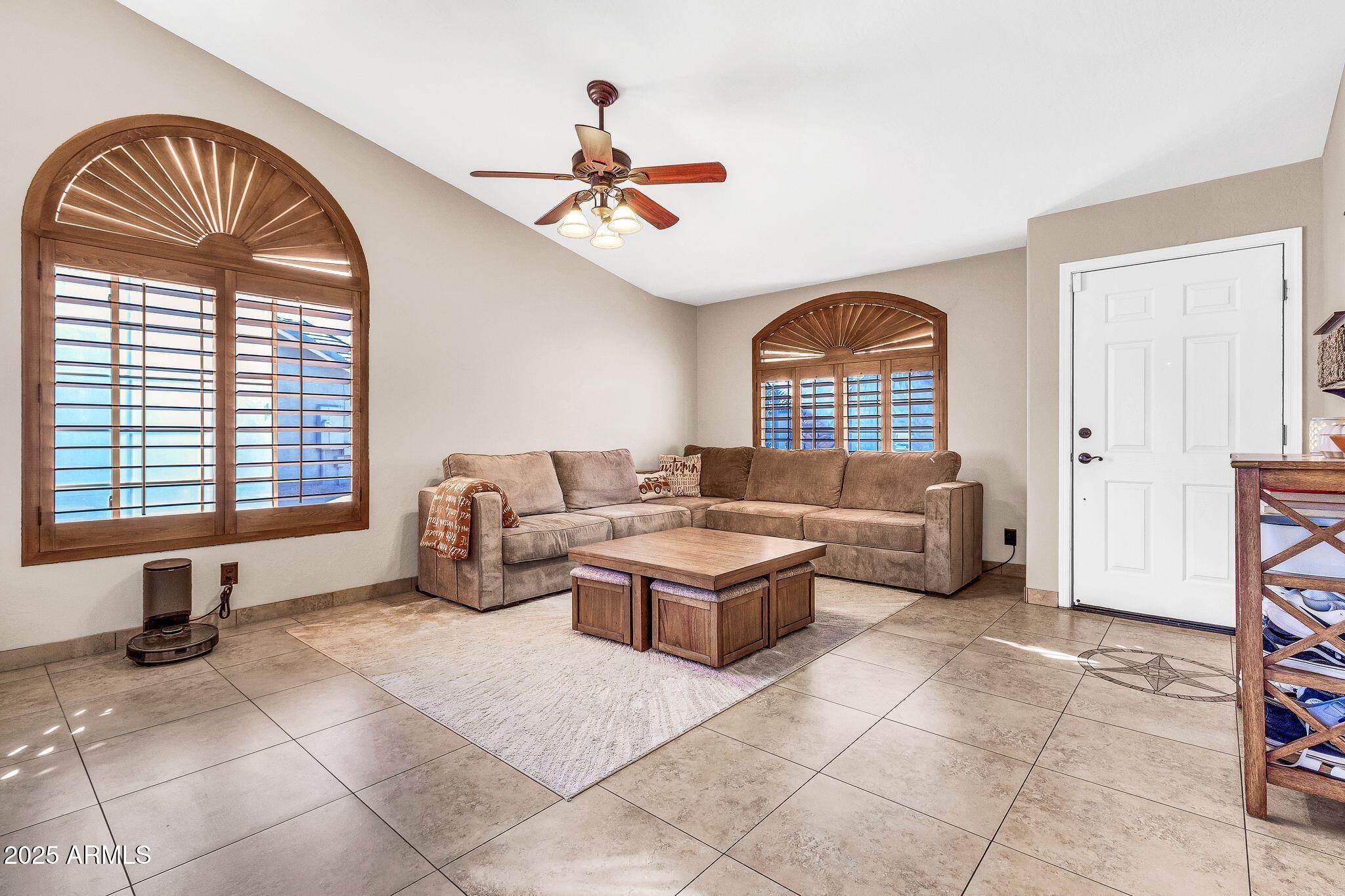 3048 East Erie Street Gilbert, AZ 85295 - Photo 4 of 44 a living room with furniture and a large window
