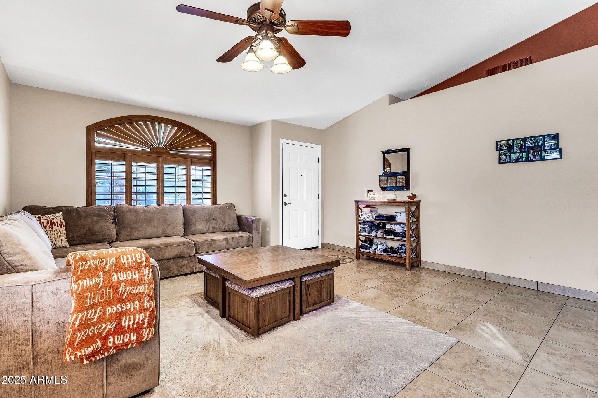3048 East Erie Street Gilbert, AZ 85295 - Photo 5 of 44 a living room with furniture and a window