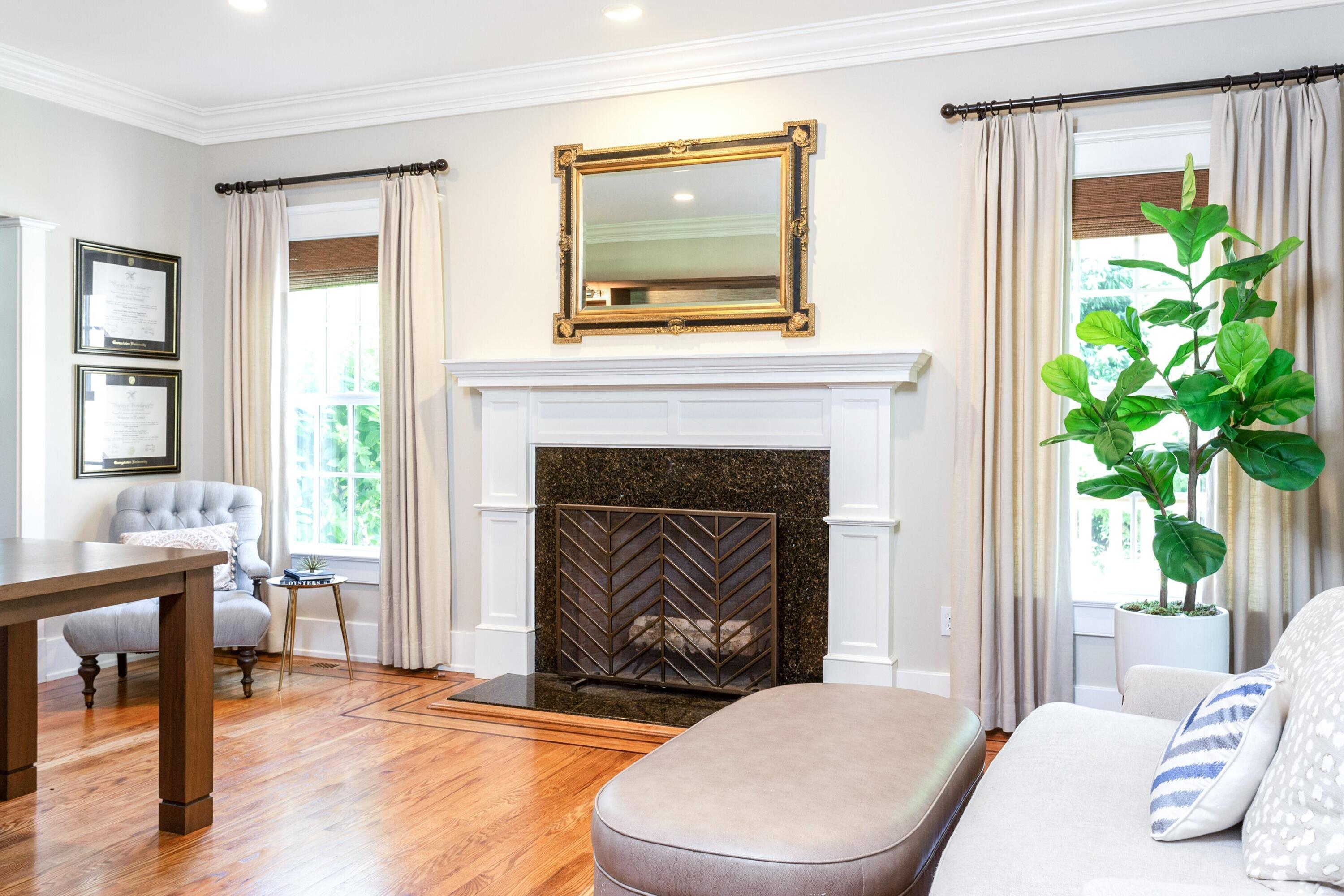 10 Wakeman Road Darien, CT 06820 - Photo 12 of 38 a living room with a fireplace a potted plant and a fireplace