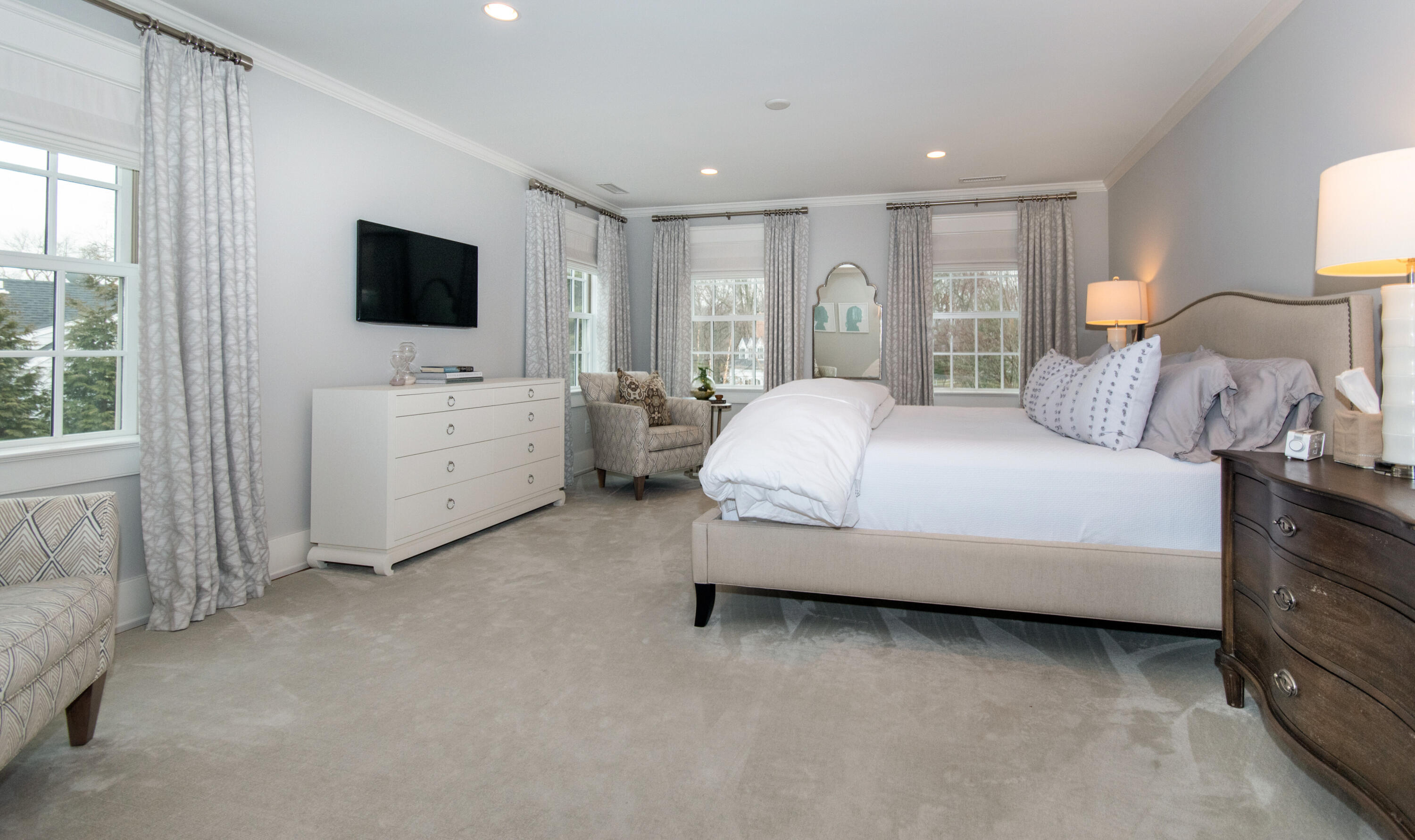 10 Wakeman Road Darien, CT 06820 - Photo 15 of 38 a spacious bedroom with a bed and a flat tv screen on dresser
