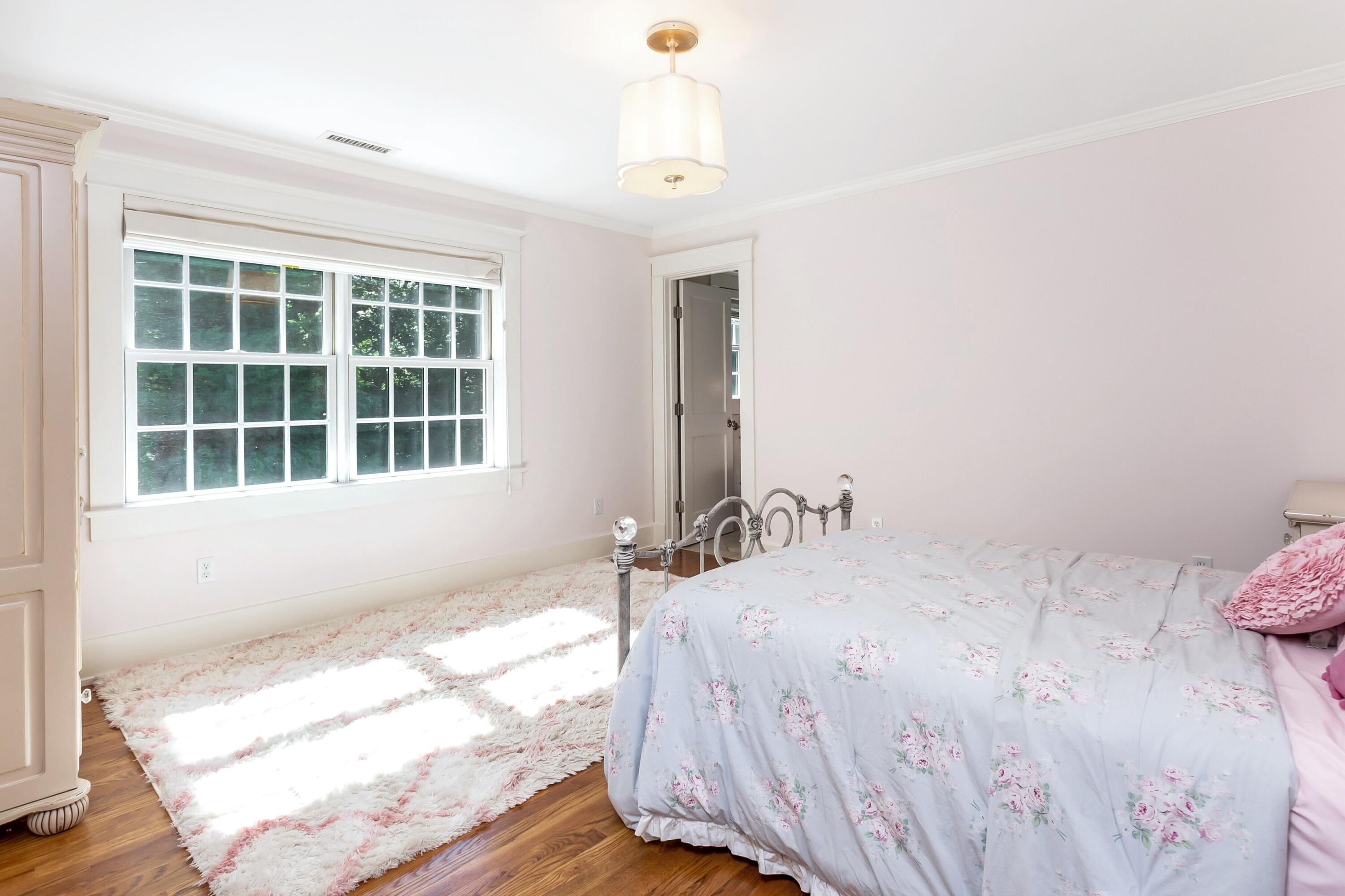 10 Wakeman Road Darien, CT 06820 - Photo 19 of 38 a bedroom with a bed and a window