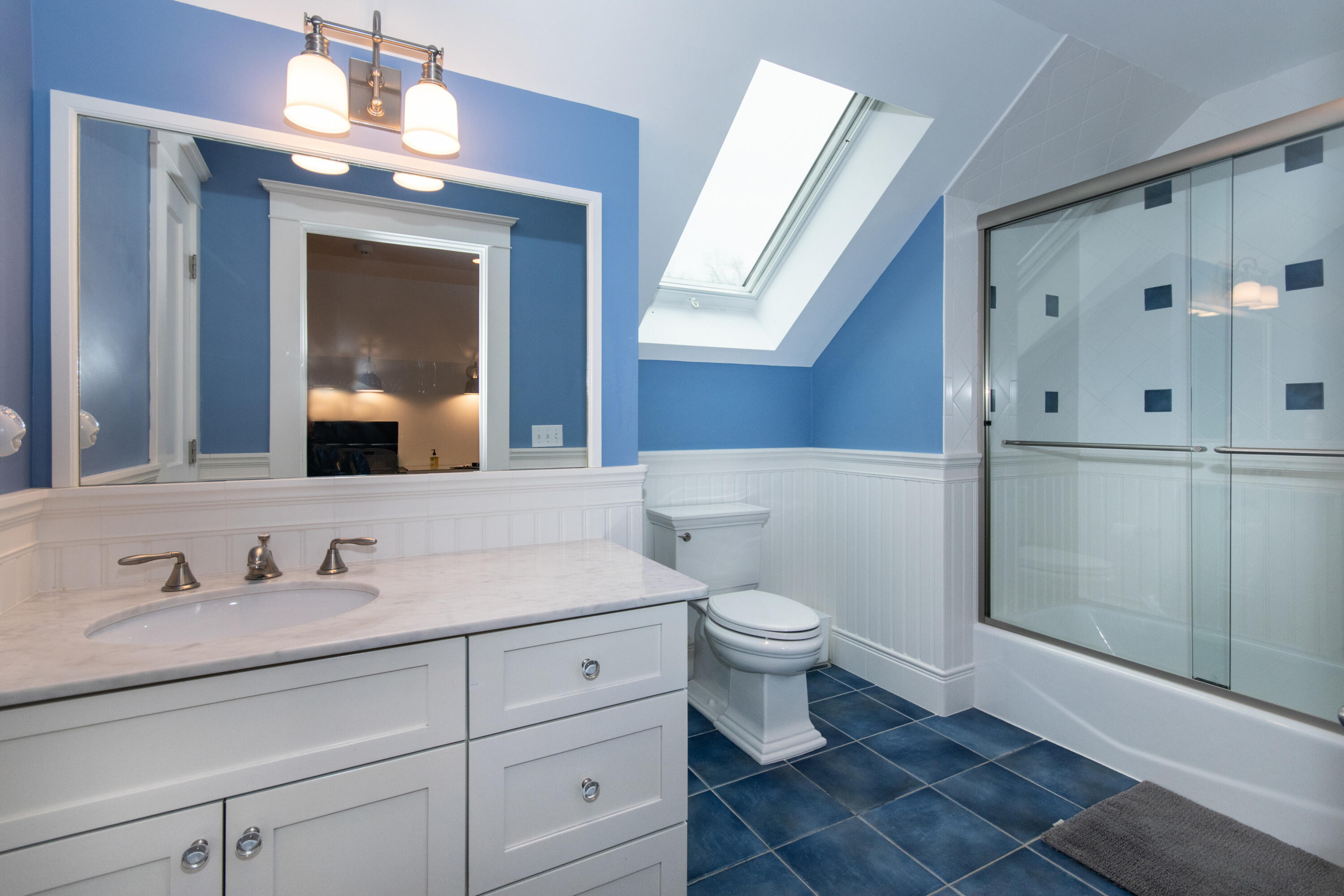 10 Wakeman Road Darien, CT 06820 - Photo 22 of 38 a bathroom with a sink a toilet and a mirror