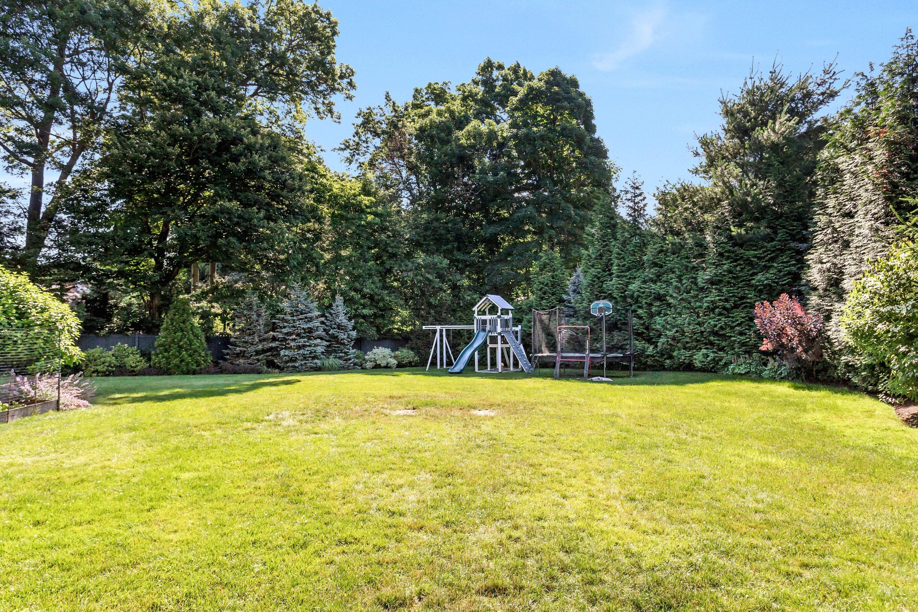 10 Wakeman Road Darien, CT 06820 - Photo 32 of 38 a view of a swimming pool with an outdoor seating and a yard