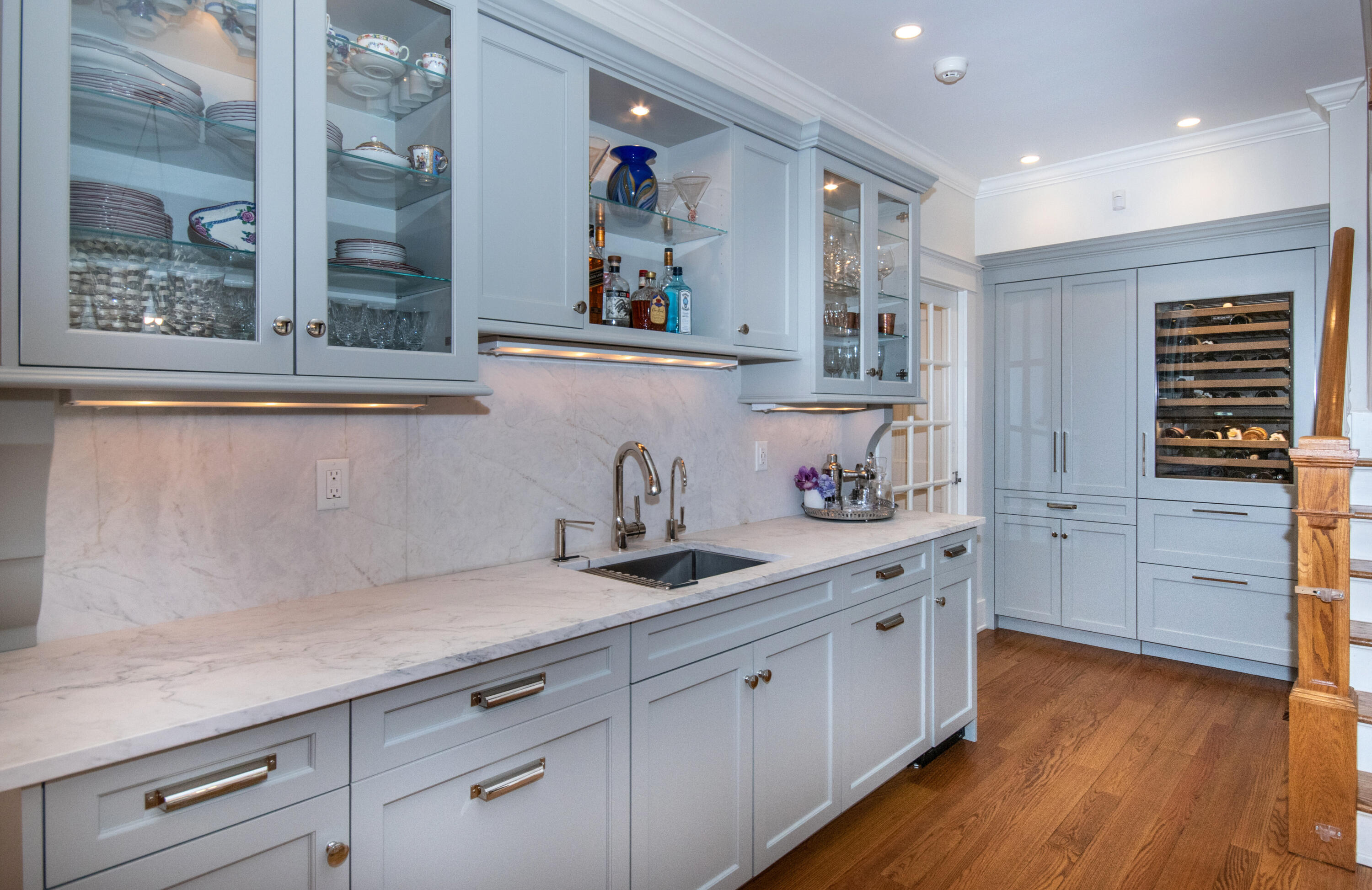 10 Wakeman Road Darien, CT 06820 - Photo 9 of 38 a kitchen with cabinets wooden floor and a large window