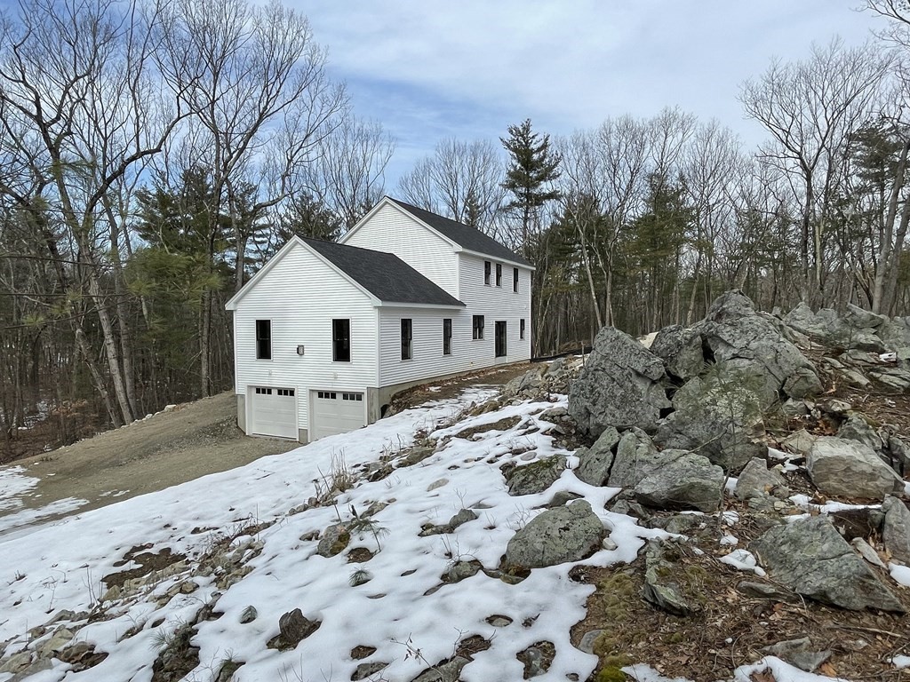 49 Old Shirley Road Harvard, MA 01451 - Photo 3 of 10 a view of a house with a yard covered in snow