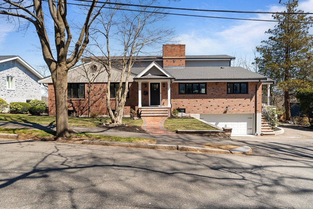 171 Shaw Road Brookline, MA 02467 - Photo 41 of 42 a front view of a house with a yard