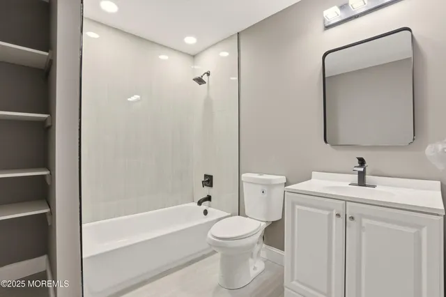 a bathroom with a toilet sink and bathtub
