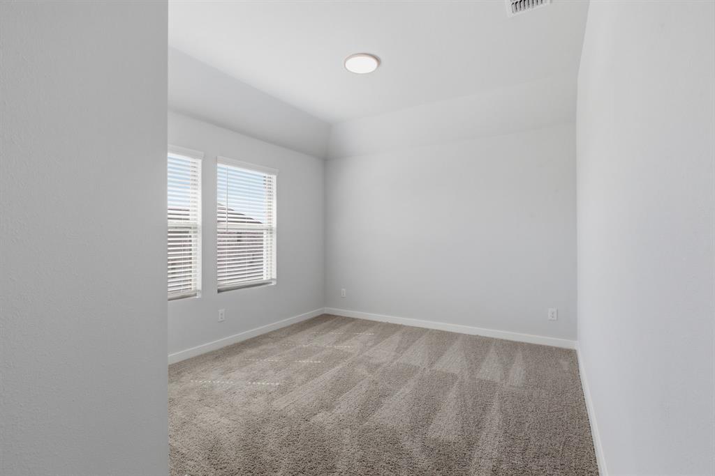 637 Sierra Ridge Lavon, TX 75166 - Photo 18 of 26 an empty room with a window