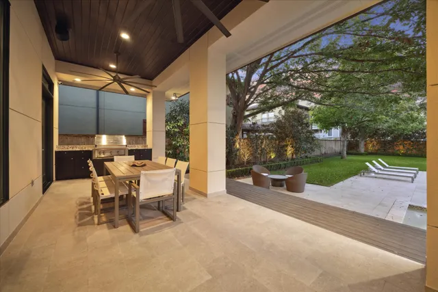 a view of a patio with a table and chairs