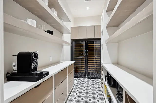 a kitchen with a sink and cabinets