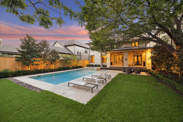 a view of a house with backyard porch and sitting area