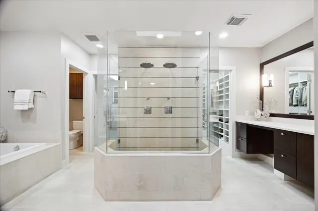 a bathroom with a bathtub and a shower