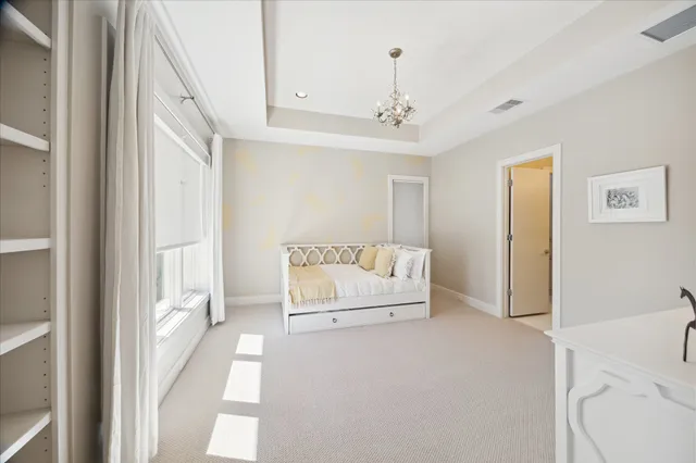 a kitchen with a sink cabinets and wooden floor
