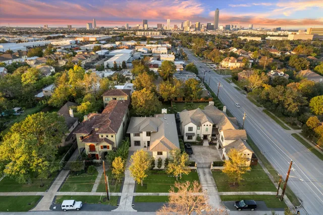 an aerial view of houses with outdoor space