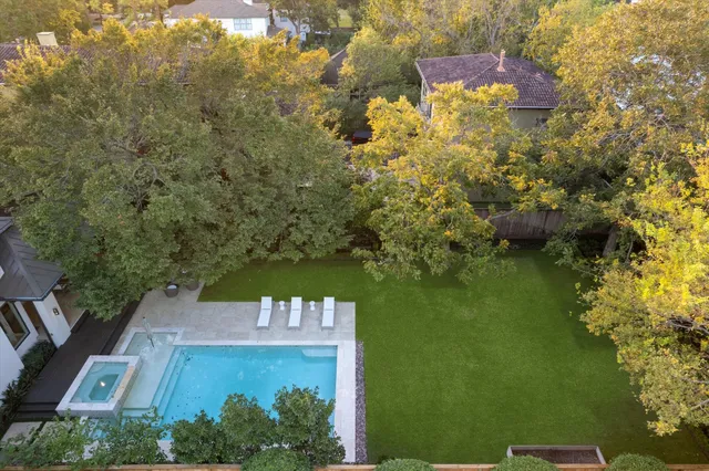 a view of swimming pool with outdoor seating