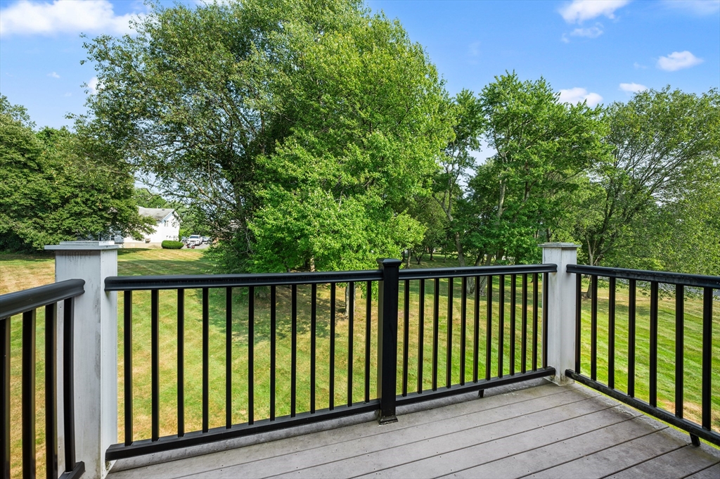 7 Walker Road, Unit 12 North Andover, MA 01845 - Photo 18 of 20 a balcony with wooden floor and fence