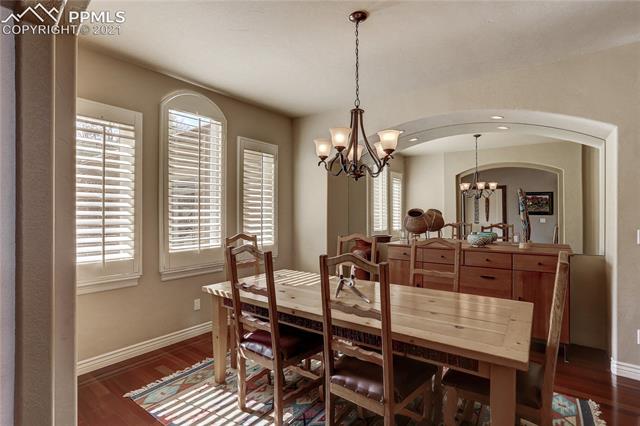 20 Keithley Road Manitou Springs, CO 80829 - Photo 5 of 42 Double arched entries into formal dining room. Mirrored wall and credenza included.