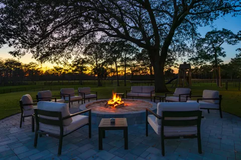 a outdoor sitting area with furniture and a table