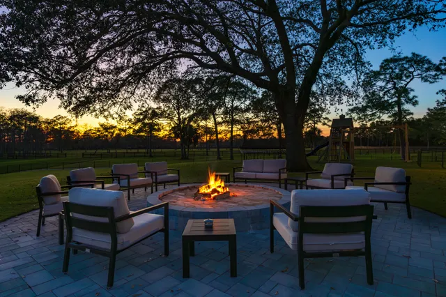 a outdoor sitting area with furniture and a table