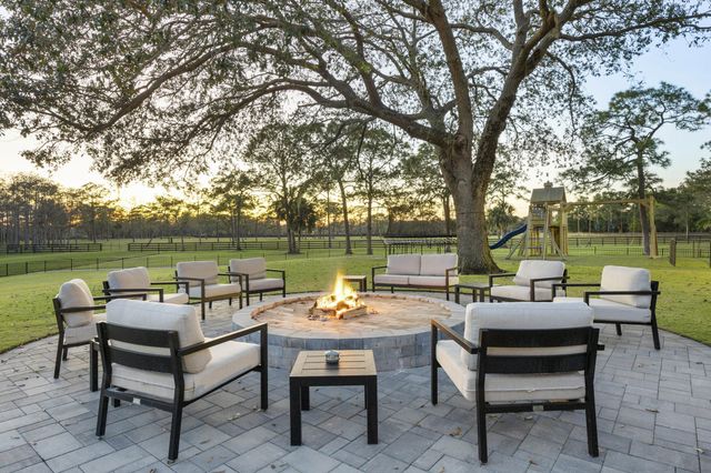 a view of a lake with couches and city view