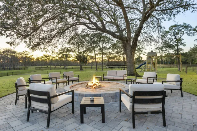 a view of a lake with couches and city view