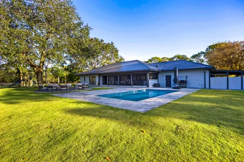 a view of a house with a swimming pool