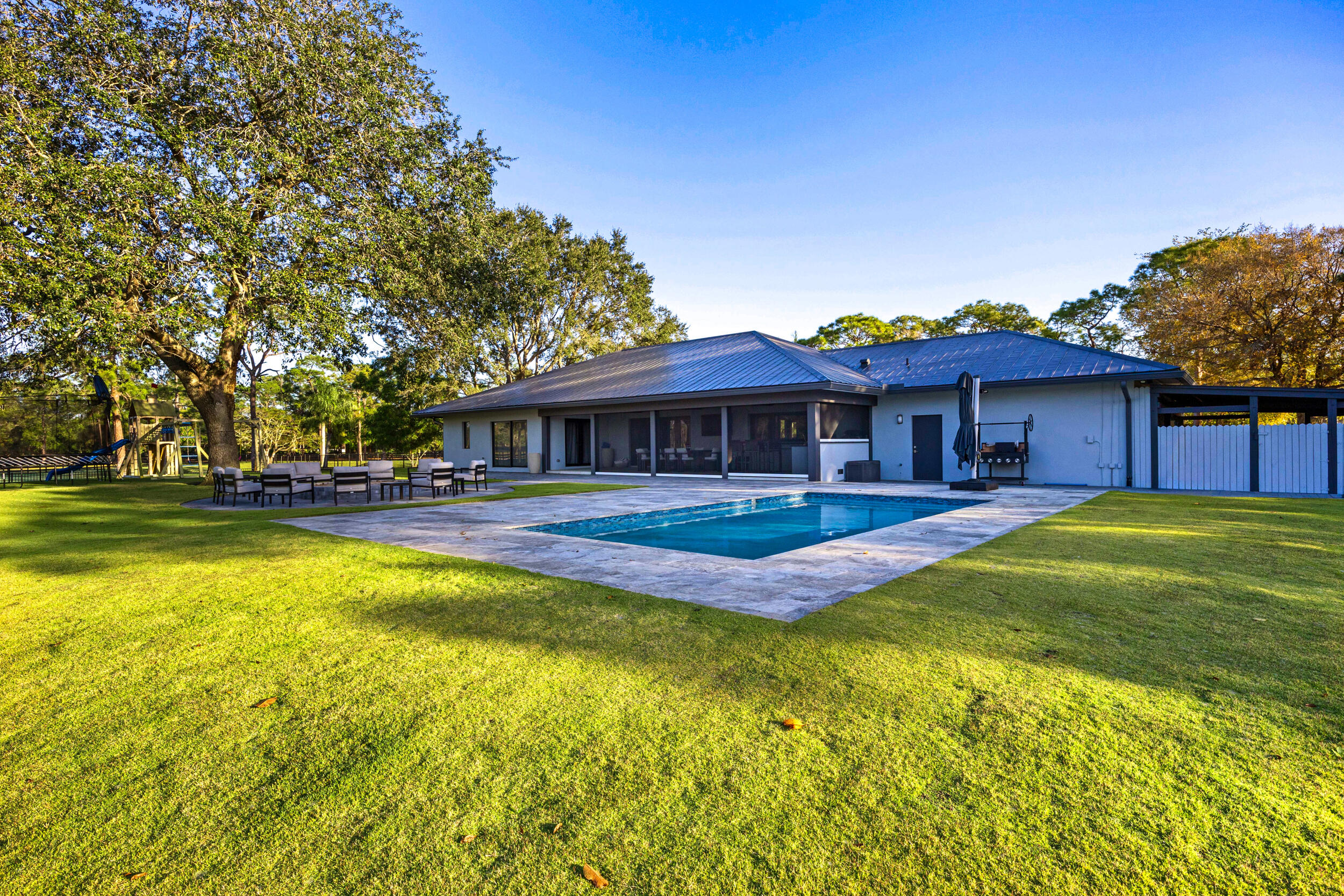 20000 Mack Dairy Road Jupiter, FL 33478 - Photo 3 of 32 a view of a house with a swimming pool