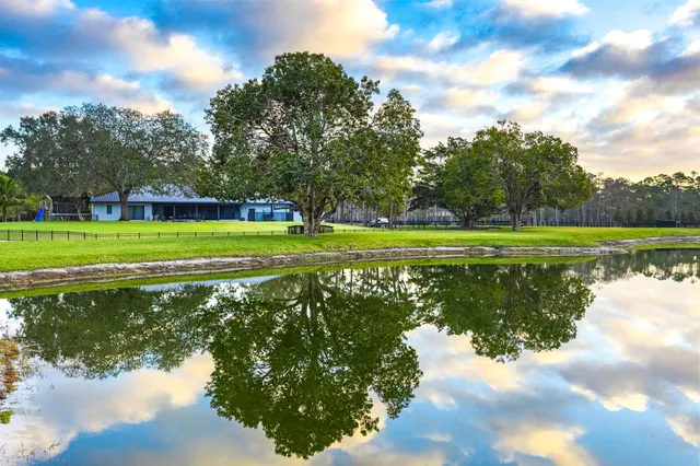 a view of a golf course with a lake