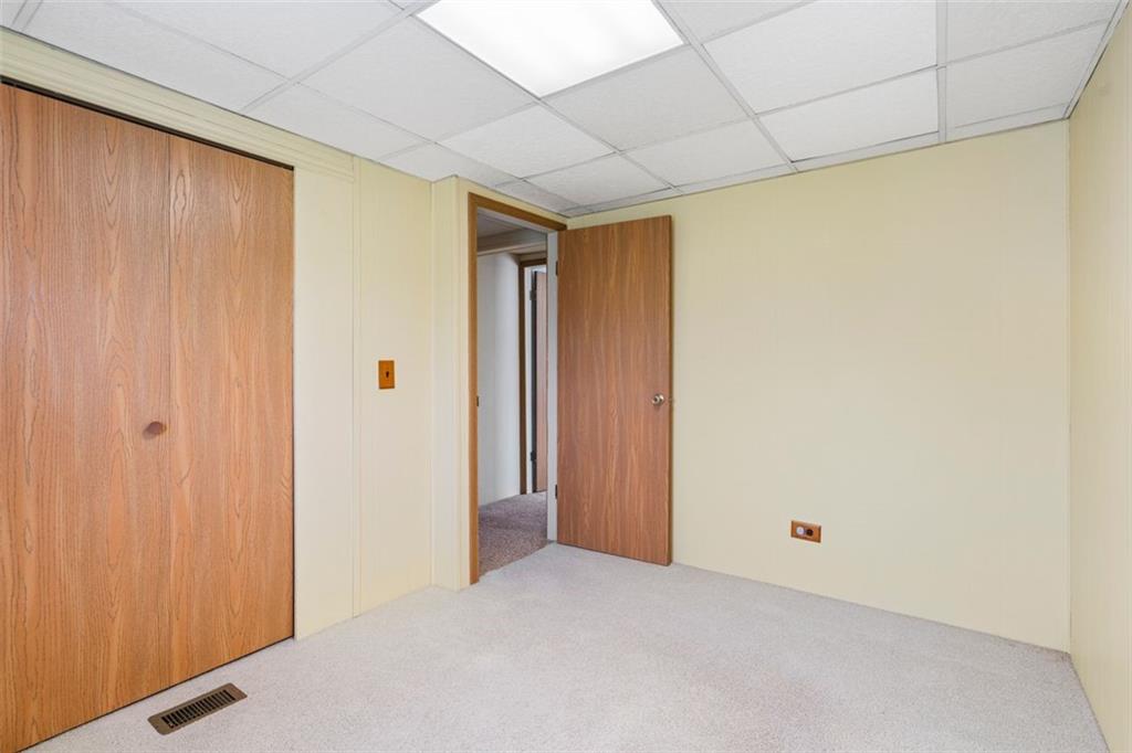 413 Pittsburgh Street New Derry, PA 15671 - Photo 15 of 23 a view of a big room with closet and wooden floor