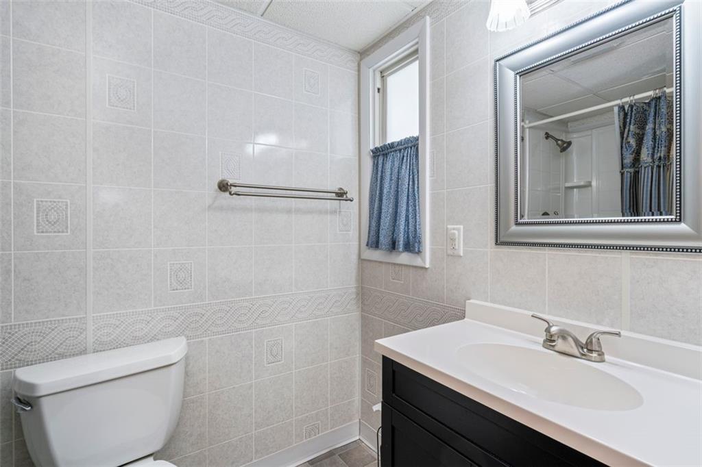 413 Pittsburgh Street New Derry, PA 15671 - Photo 17 of 23 a bathroom with a sink toilet and vanity