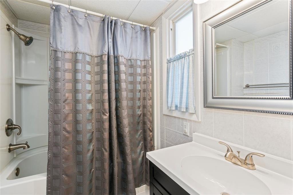 413 Pittsburgh Street New Derry, PA 15671 - Photo 20 of 23 a bathroom with a sink and a mirror