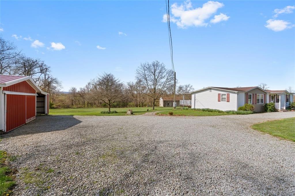 413 Pittsburgh Street New Derry, PA 15671 - Photo 3 of 23 a view of a house with a big yard