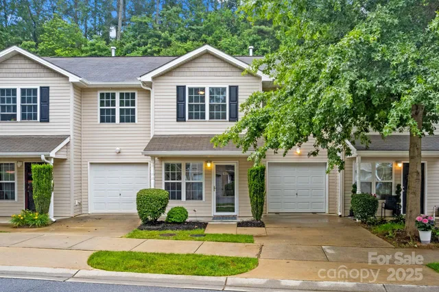 a front view of a house with a yard and porch