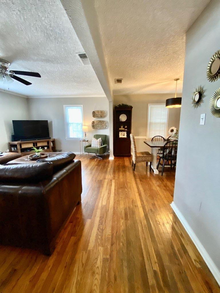 2514 29th Street Lubbock, TX 79410 - Photo 2 of 8 a living room with furniture and a wooden floor